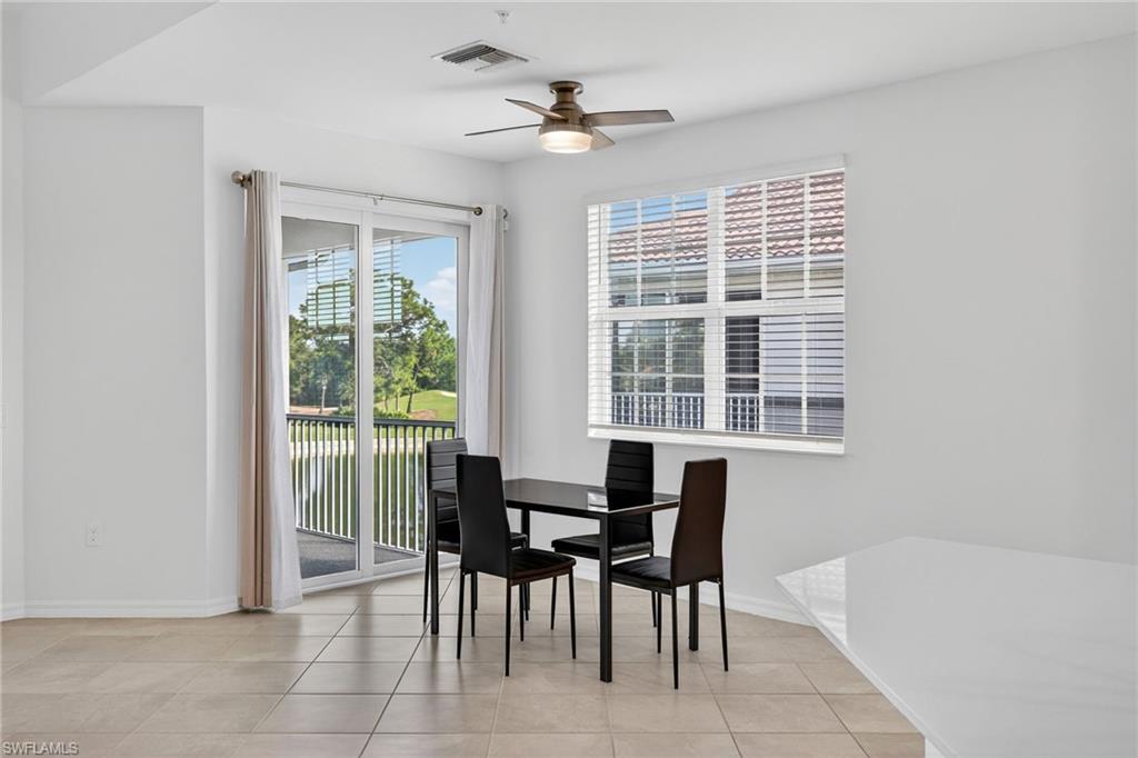 12041 Santaluz Drive, Unit 202 Fort Myers, FL 33913 - Photo 8 of 42 Dining room with ceiling fan and light tile patterned floors