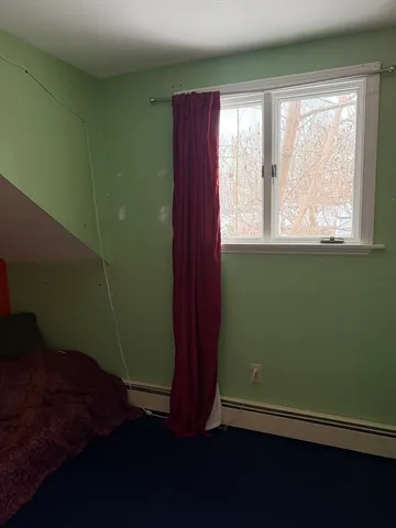 a view of room with window and hardwood