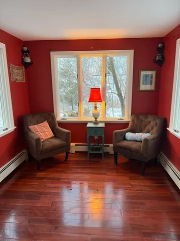 a living room with furniture and a large window