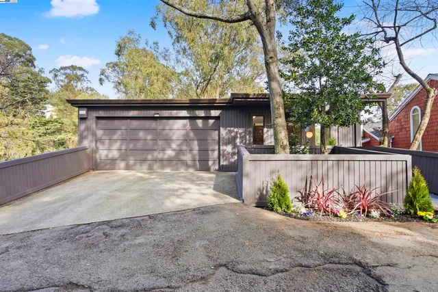 a view of a street with a garage
