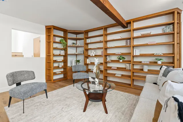a view of a livingroom with furniture and a window