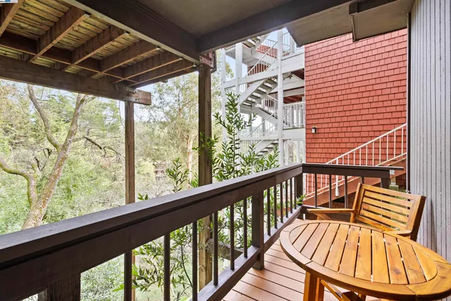a view of a balcony with chairs