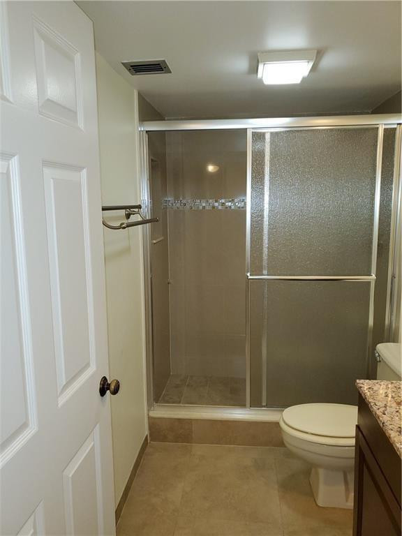 6061 Balboa Circle, Unit 201 Boca Raton, FL 33433 - Photo 3 of 7 a bathroom with a toilet and a shower