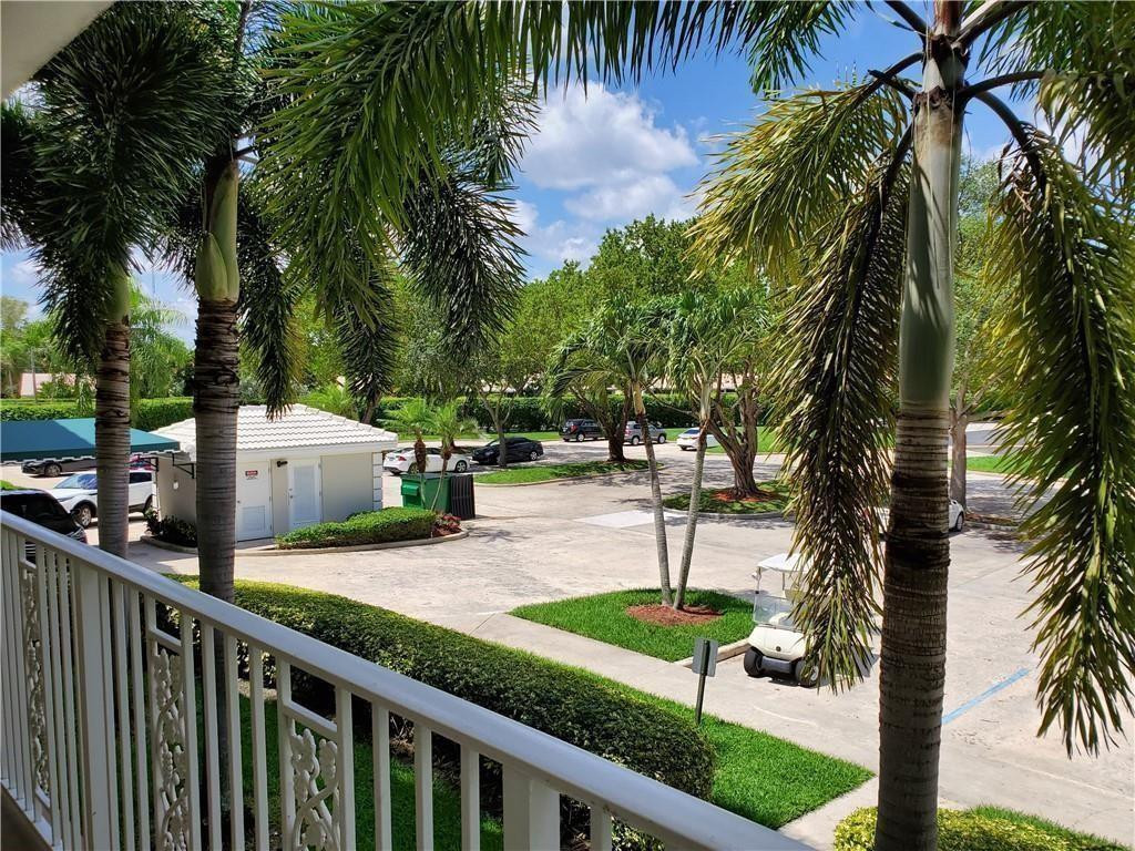 6061 Balboa Circle, Unit 201 Boca Raton, FL 33433 - Photo 6 of 7 a park view with palm trees