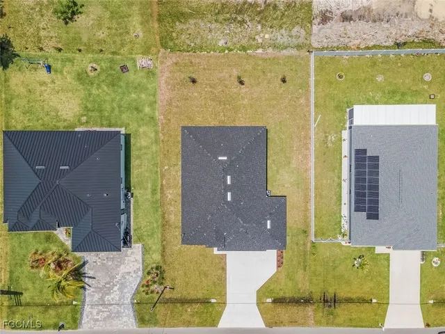 aerial view of a house with a yard