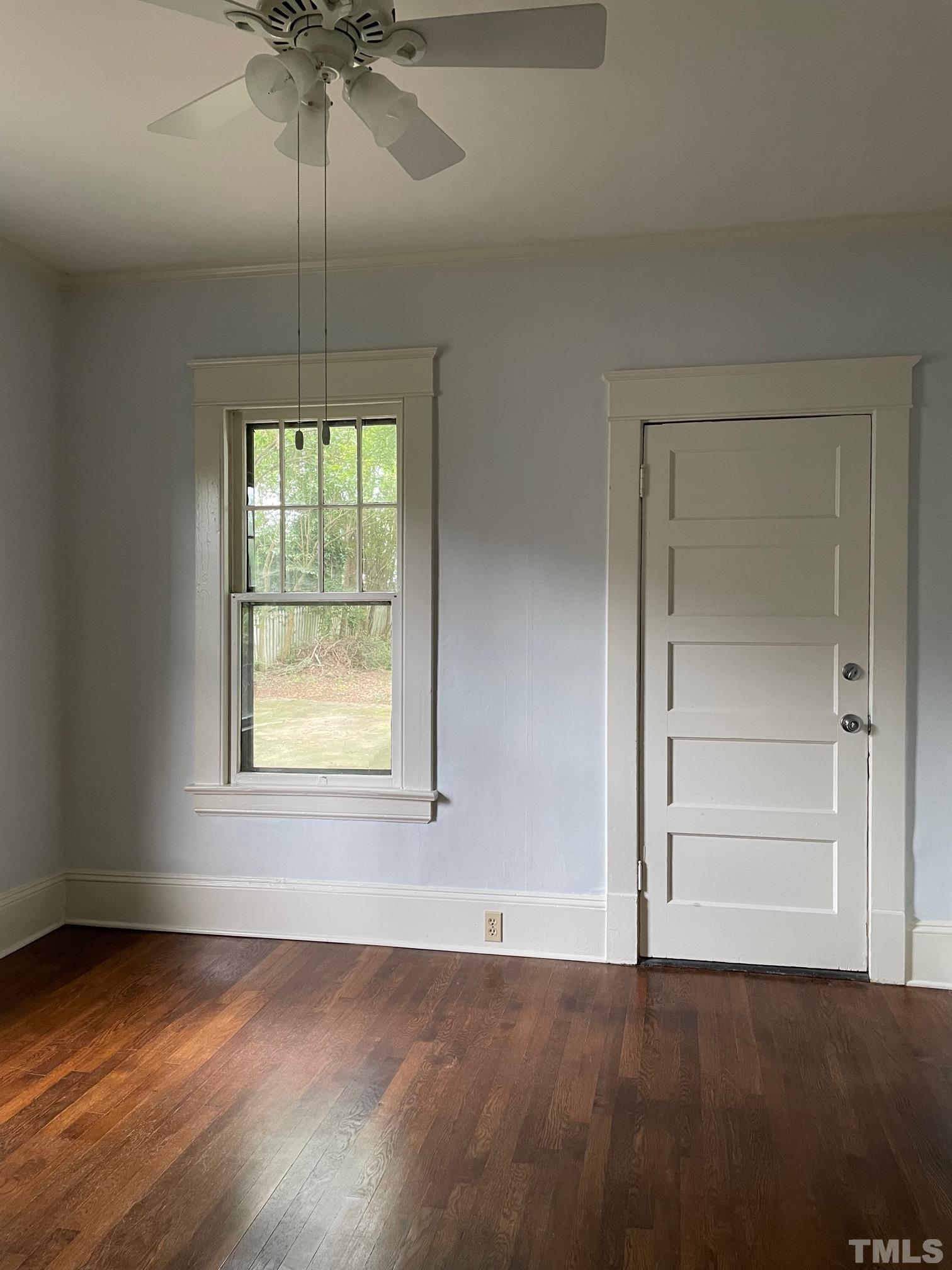 220 Glascock Street Raleigh, NC 27604 - Photo 11 of 21 an empty room with a window and chandelier fan