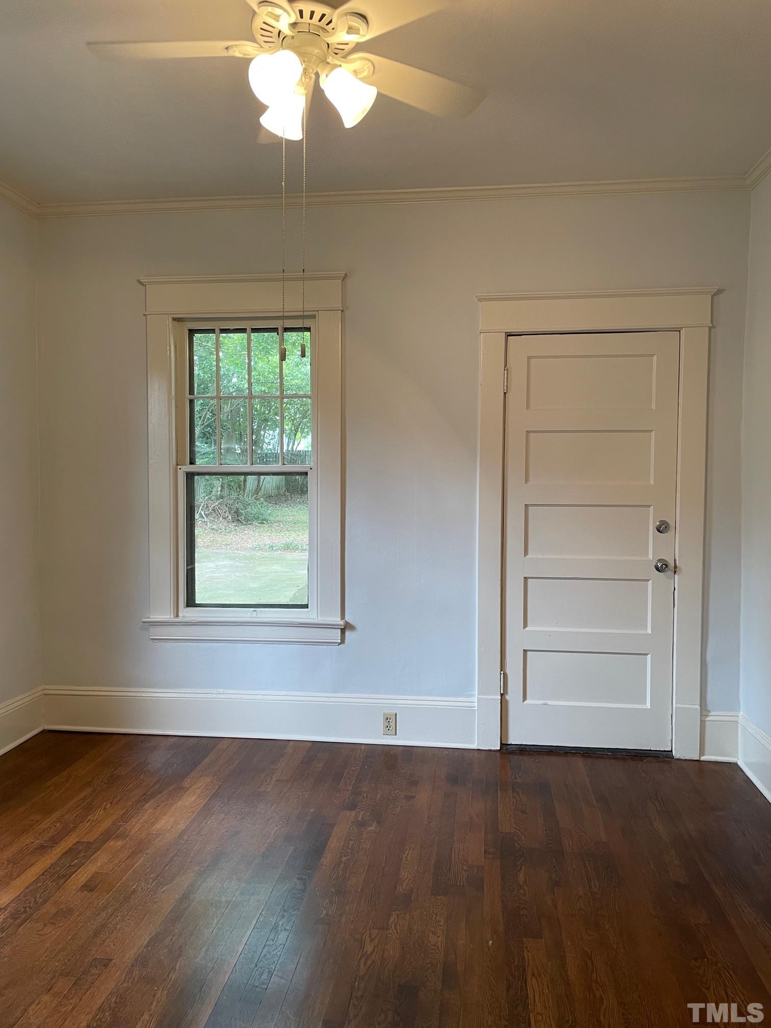 220 Glascock Street Raleigh, NC 27604 - Photo 13 of 21 an empty room with wooden floor cabinet and window