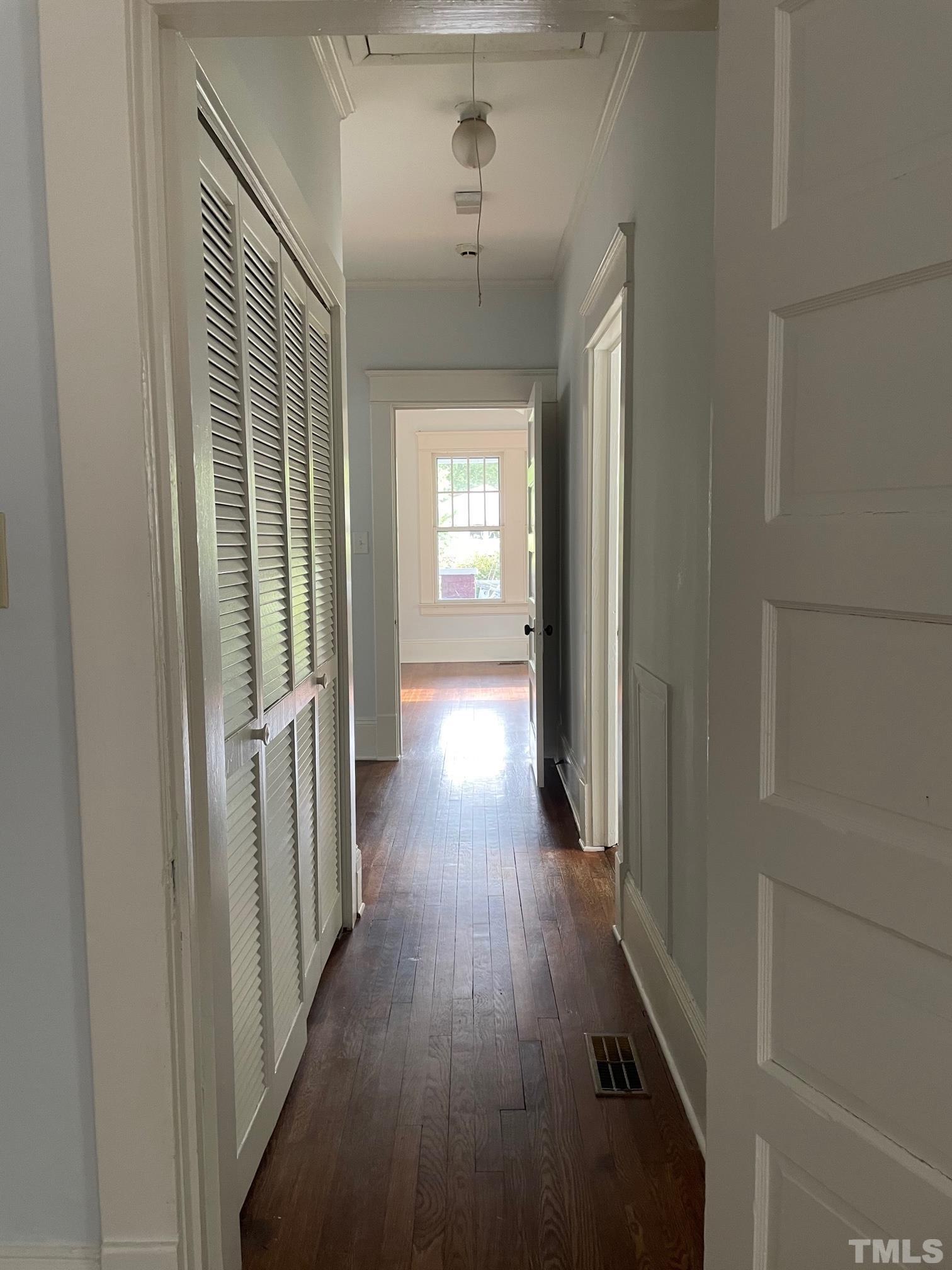 220 Glascock Street Raleigh, NC 27604 - Photo 20 of 21 a view of hallway with wooden floor and stairs