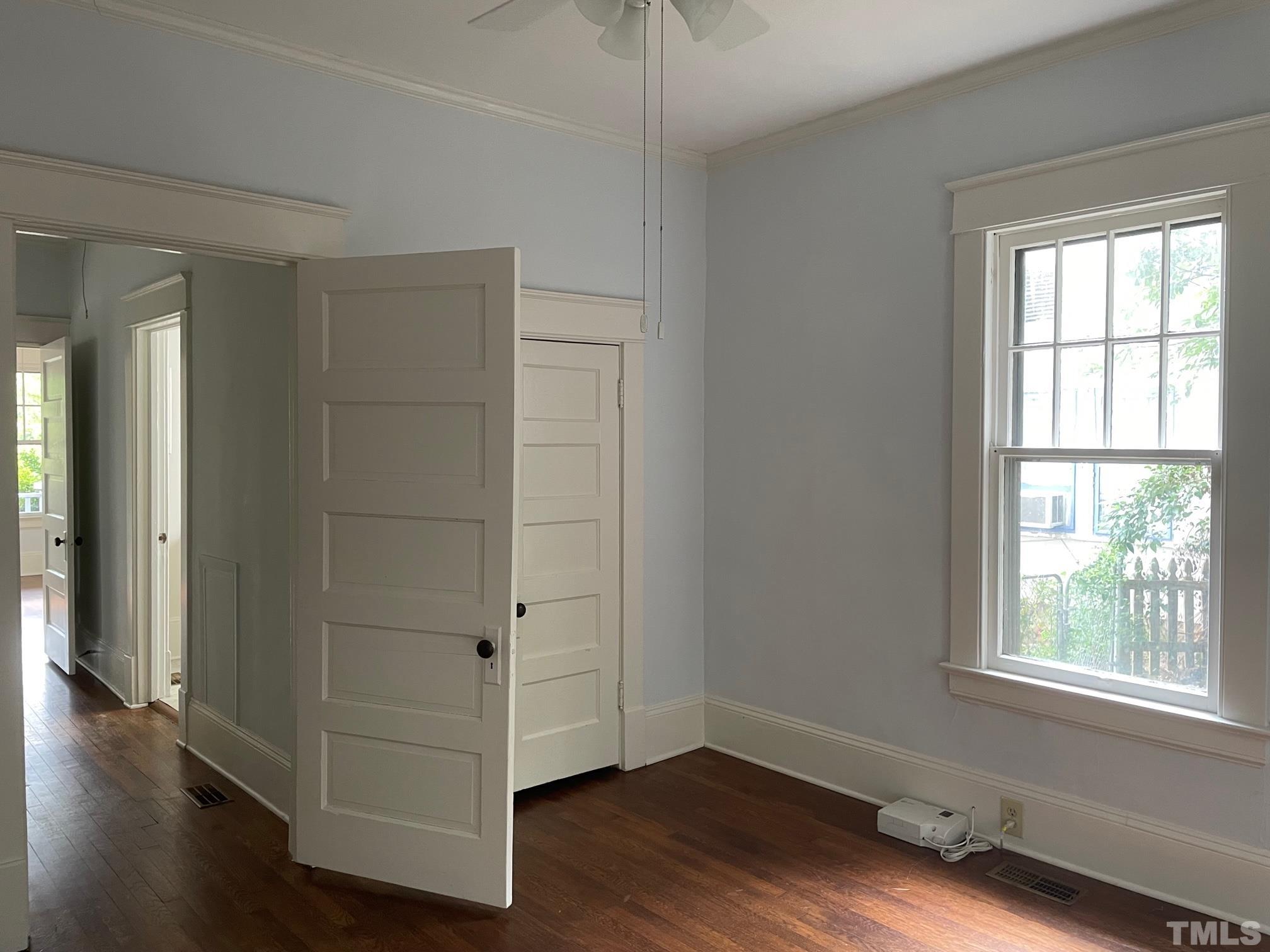 220 Glascock Street Raleigh, NC 27604 - Photo 21 of 21 a view of an empty room with wooden floor and a window