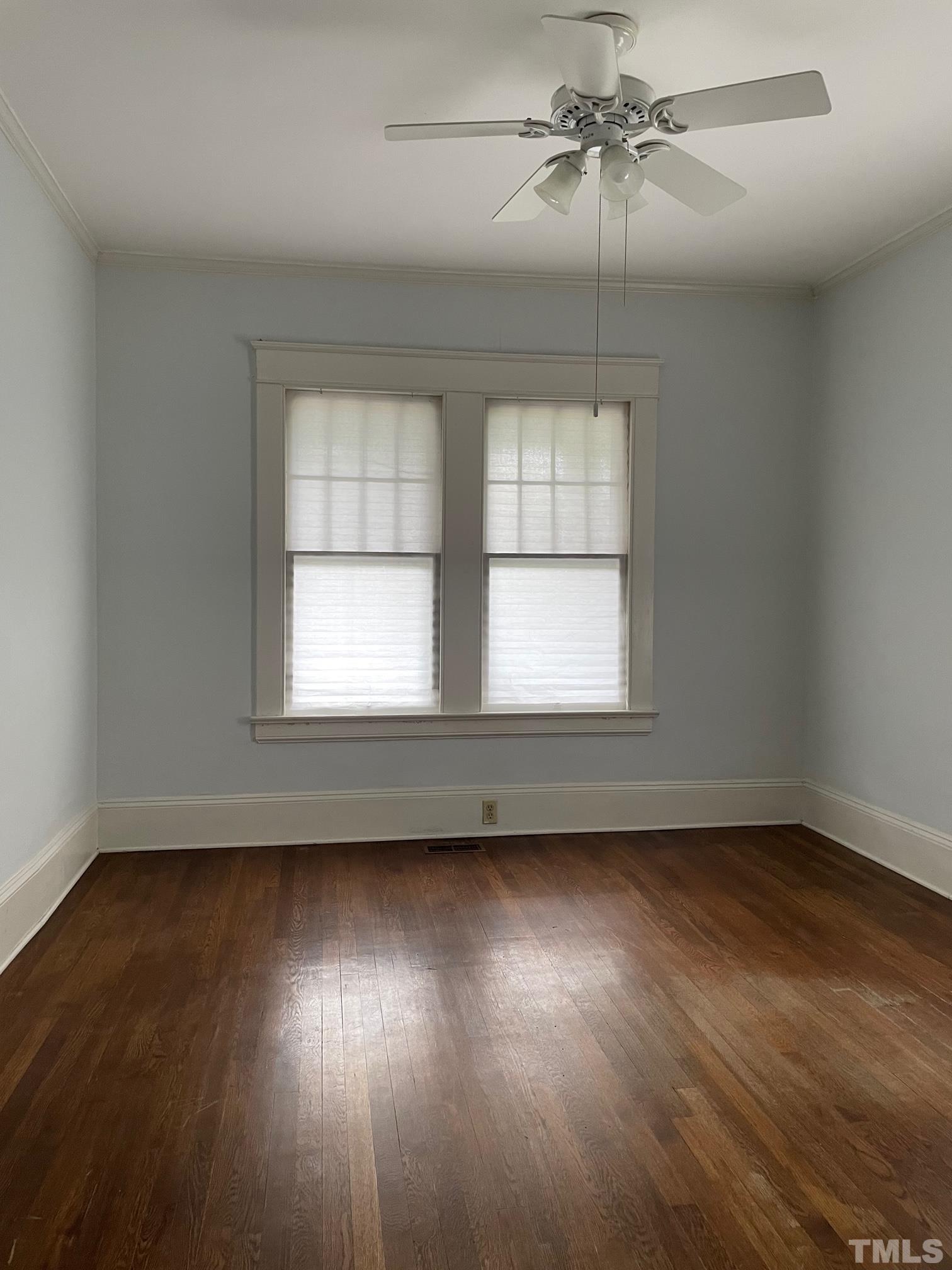 220 Glascock Street Raleigh, NC 27604 - Photo 9 of 21 an empty room with wooden floor and windows