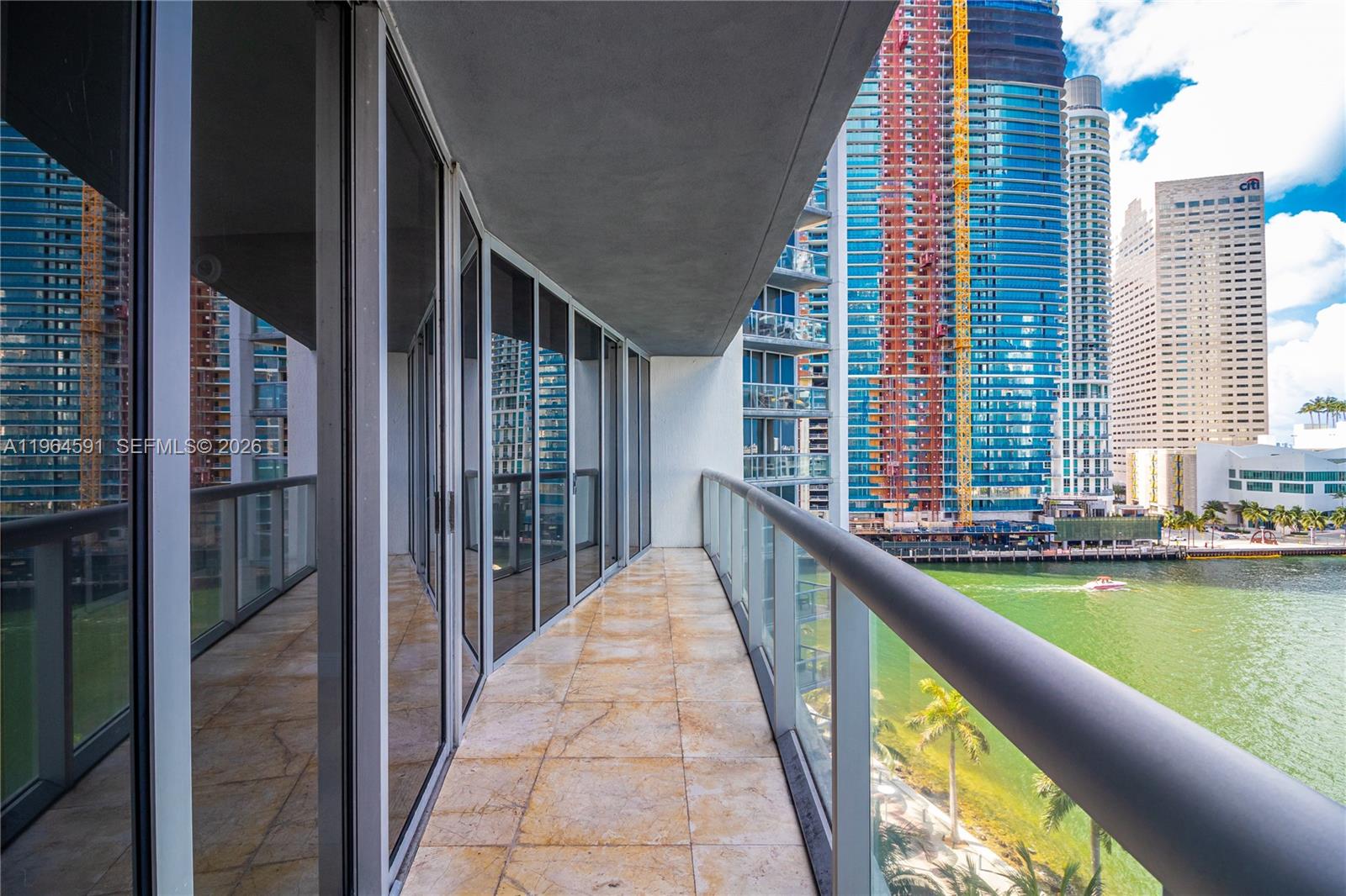 465 Brickell Avenue, Unit 917 Miami, FL 33131 - Photo 17 of 21 a view of balcony with two chairs and a table