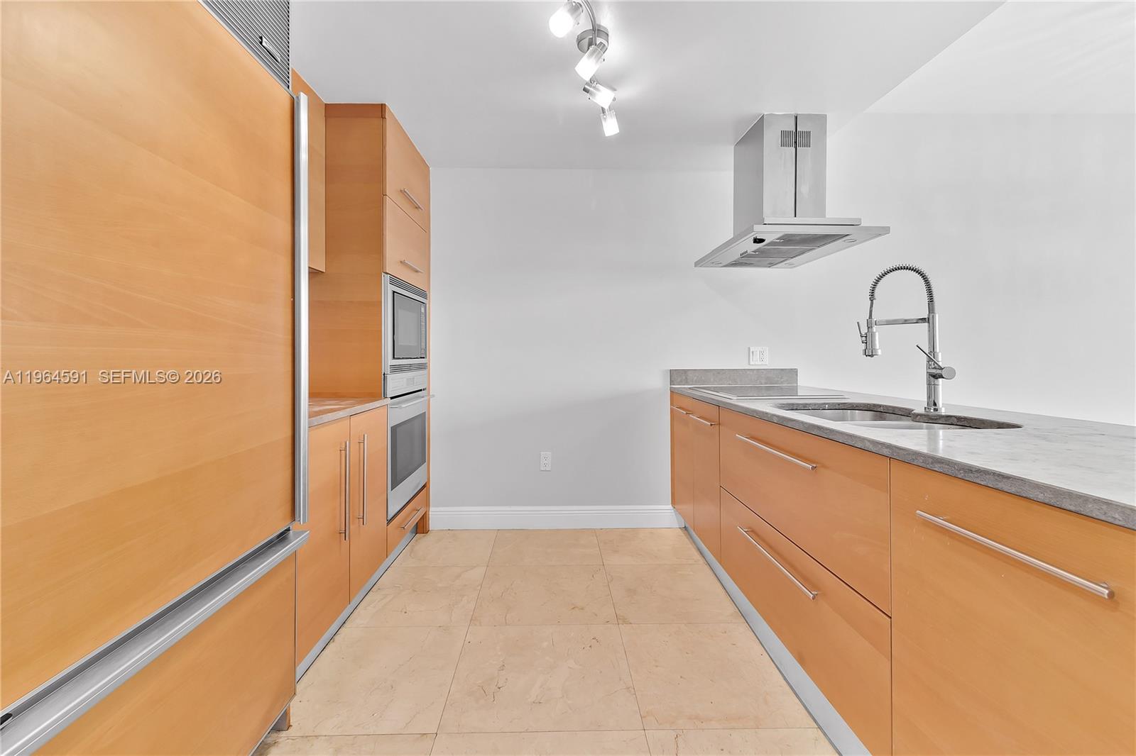 465 Brickell Avenue, Unit 917 Miami, FL 33131 - Photo 5 of 21 a bathroom with a sink a mirror and shower