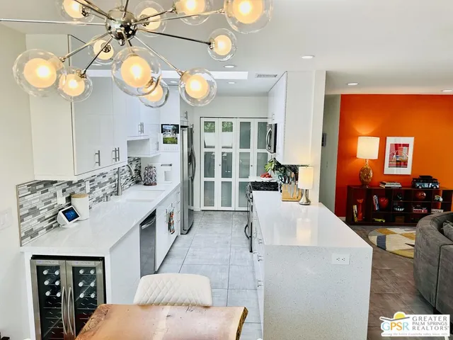 a kitchen with stove top oven and cabinets