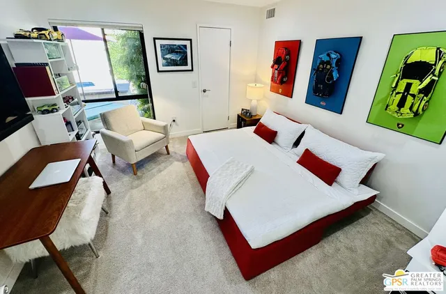 a balcony with outdoor seating and city view