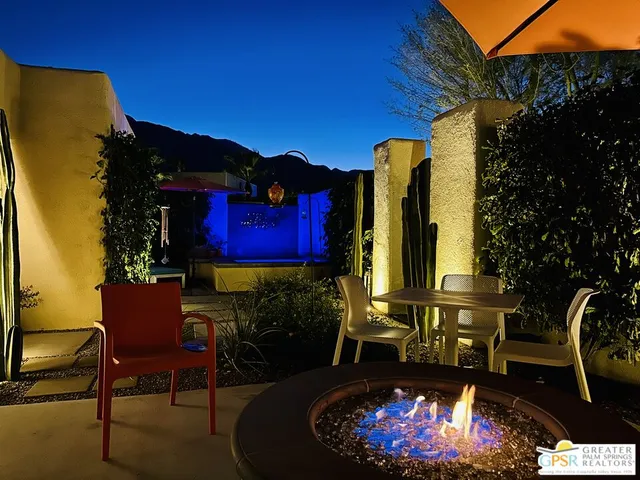 a view of a swimming pool with a yard