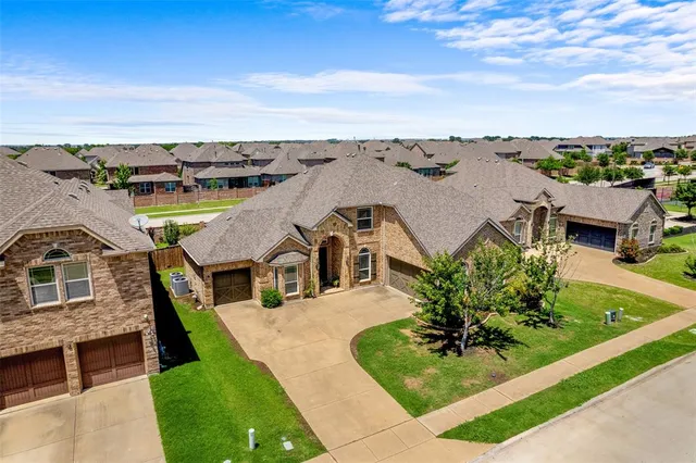 an aerial view of a house with a garden