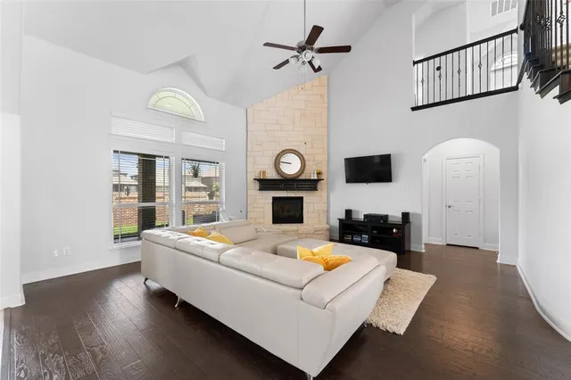 a living room with furniture and a fireplace