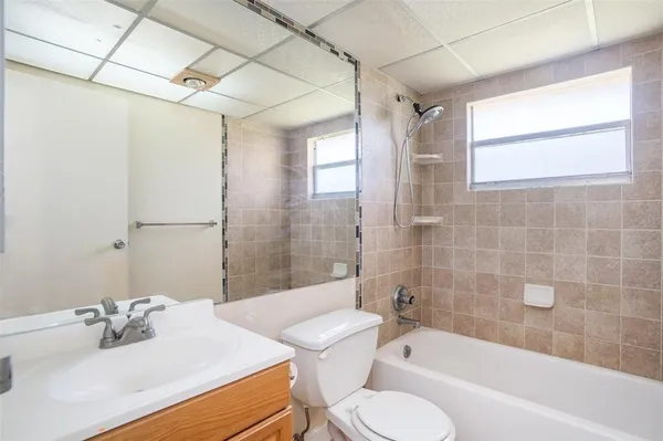 a bathroom with a sink toilet bathtub and shower