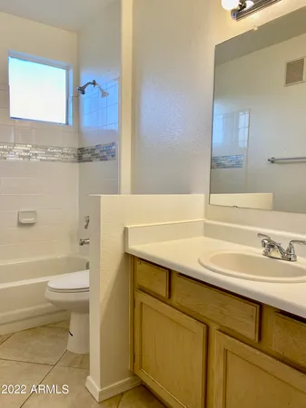 a bathroom with a sink a toilet and a bathtub