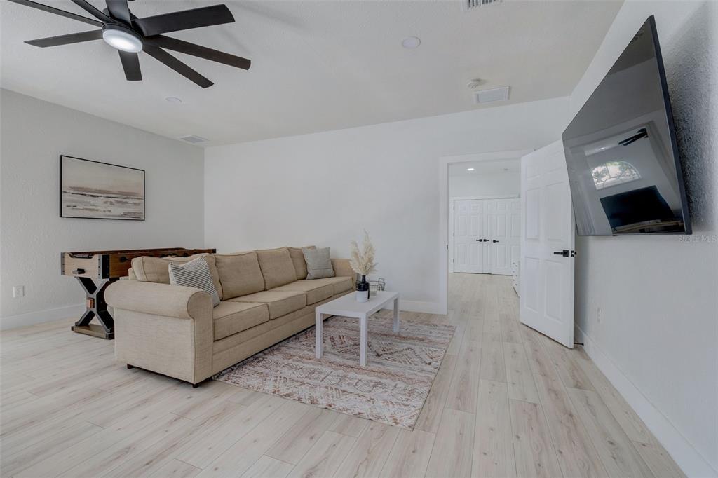 3030 Ashton Road Sarasota, FL 34231 - Photo 11 of 41 a living room with furniture and a flat screen tv