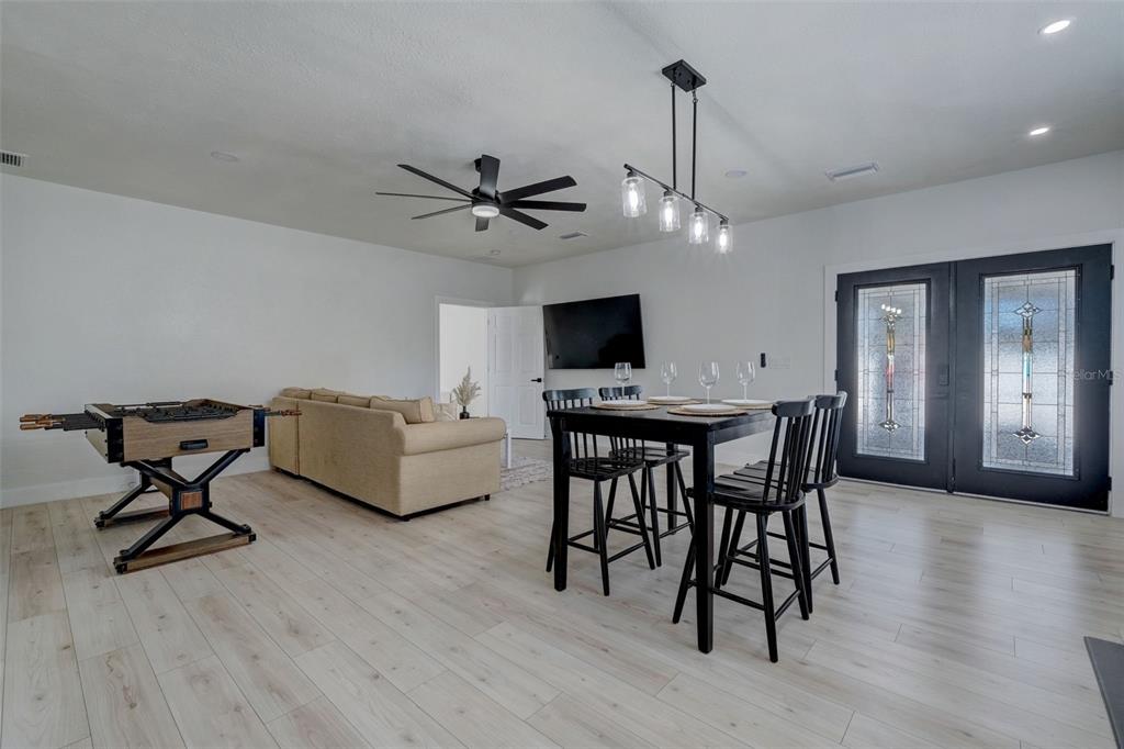 3030 Ashton Road Sarasota, FL 34231 - Photo 13 of 41 a living room with furniture and a flat screen tv