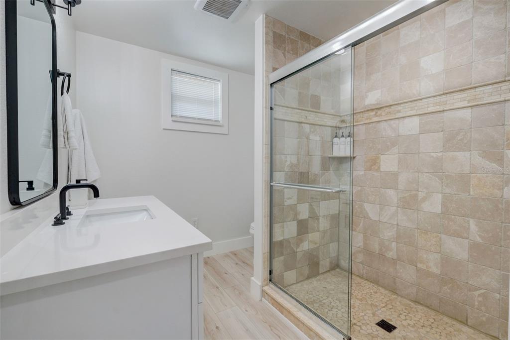 3030 Ashton Road Sarasota, FL 34231 - Photo 14 of 41 a bathroom with a shower and a sink