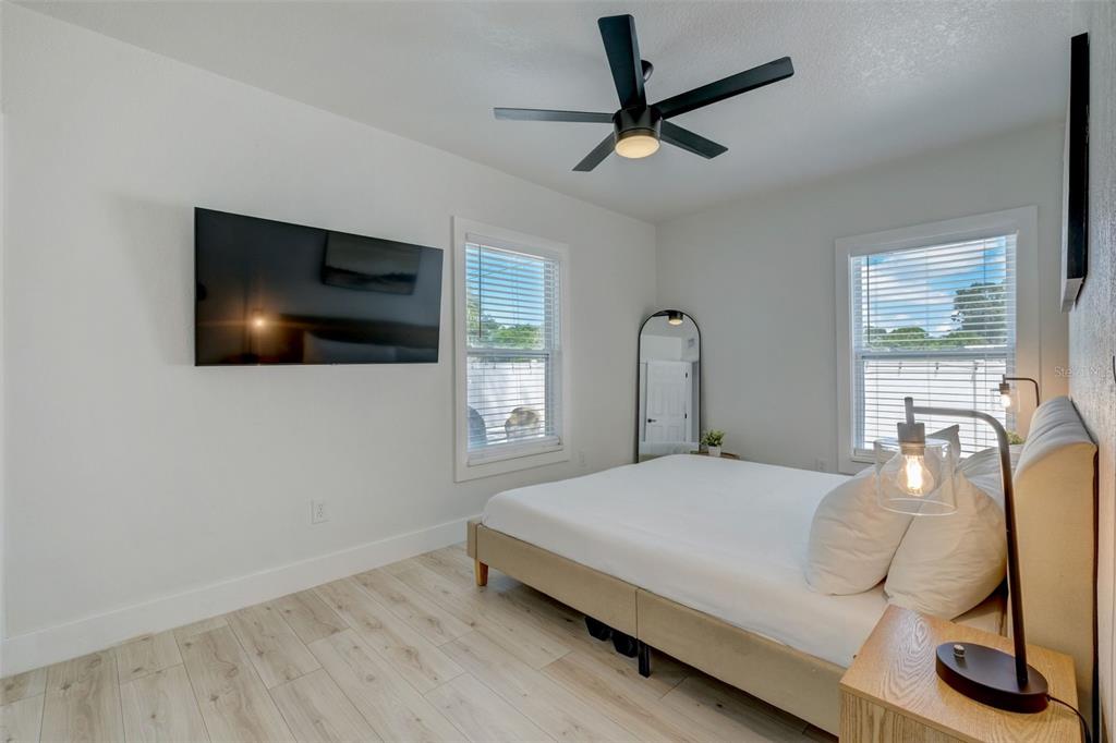 3030 Ashton Road Sarasota, FL 34231 - Photo 18 of 41 a bedroom with a bed and a flat screen tv
