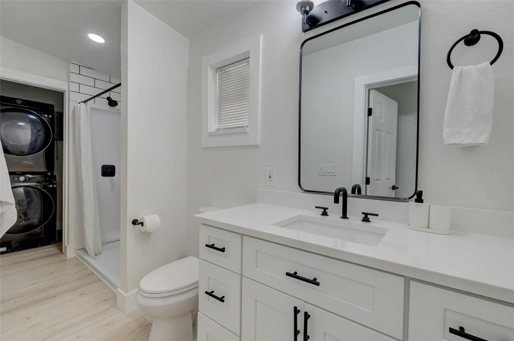 3030 Ashton Road Sarasota, FL 34231 - Photo 20 of 41 a bathroom with a sink a toilet and a mirror