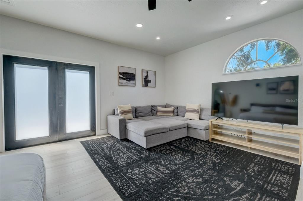 3030 Ashton Road Sarasota, FL 34231 - Photo 23 of 41 a living room with furniture and a flat screen tv