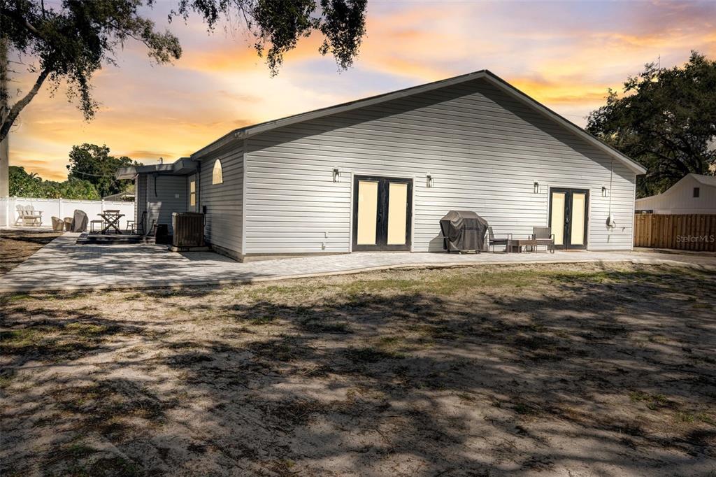 3030 Ashton Road Sarasota, FL 34231 - Photo 37 of 41 a front view of a house with a yard