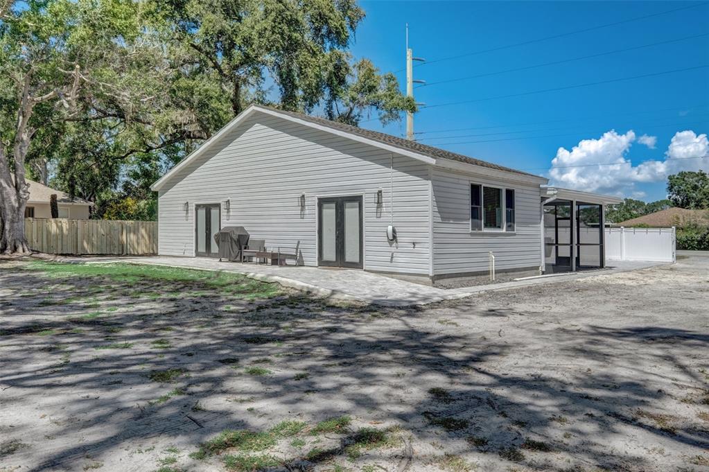3030 Ashton Road Sarasota, FL 34231 - Photo 38 of 41 a view of a house with a yard