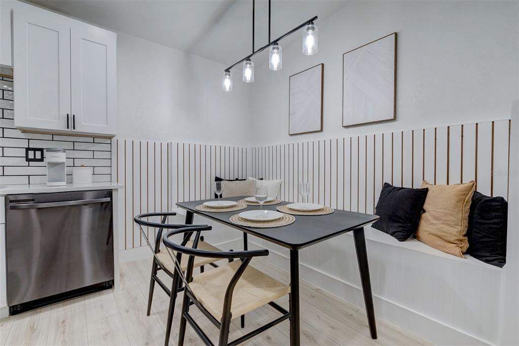 3030 Ashton Road Sarasota, FL 34231 - Photo 7 of 41 a table and chairs in a kitchen