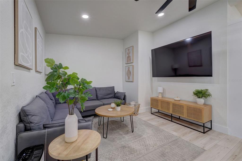 3030 Ashton Road Sarasota, FL 34231 - Photo 10 of 41 a living room with furniture and a flat screen tv