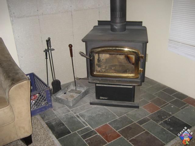 6073 Goss Road Phelan, CA 92371 - Photo 10 of 17 a living room with a fireplace
