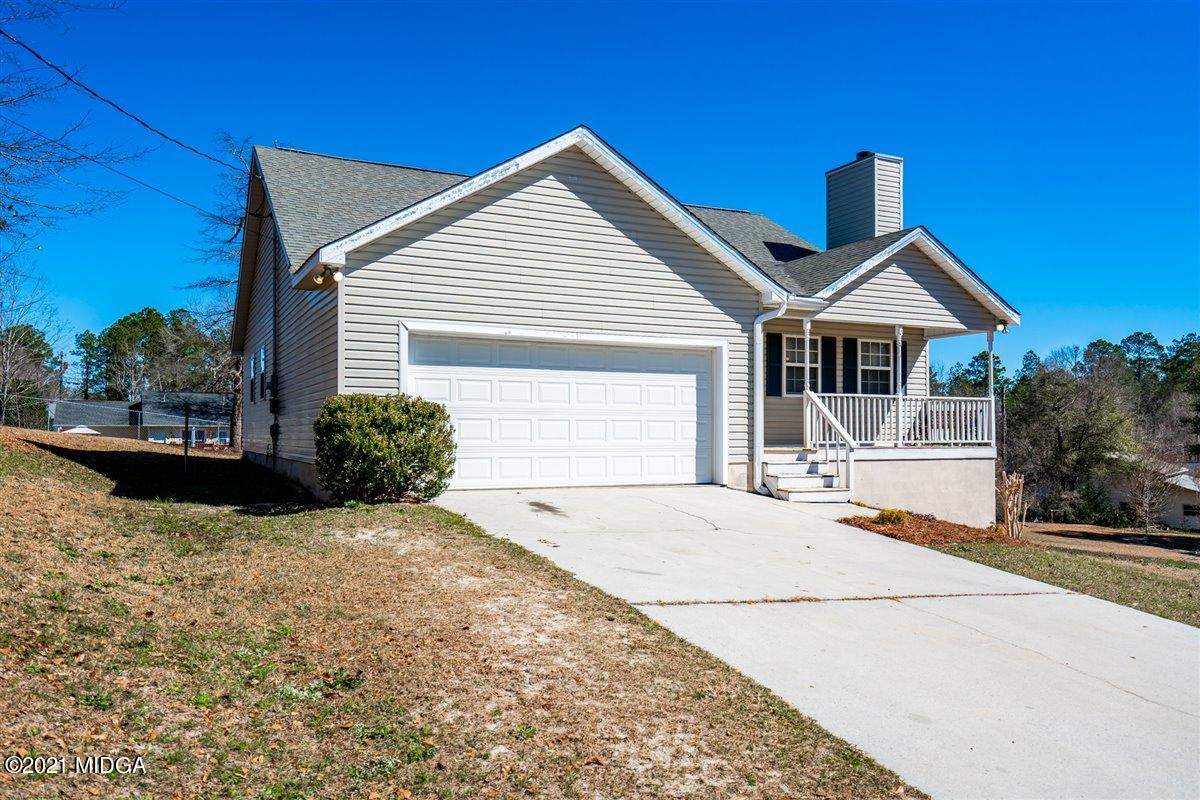 306 Jason Court Macon, GA 31216 - Photo 2 of 22 a front view of a house with a garden