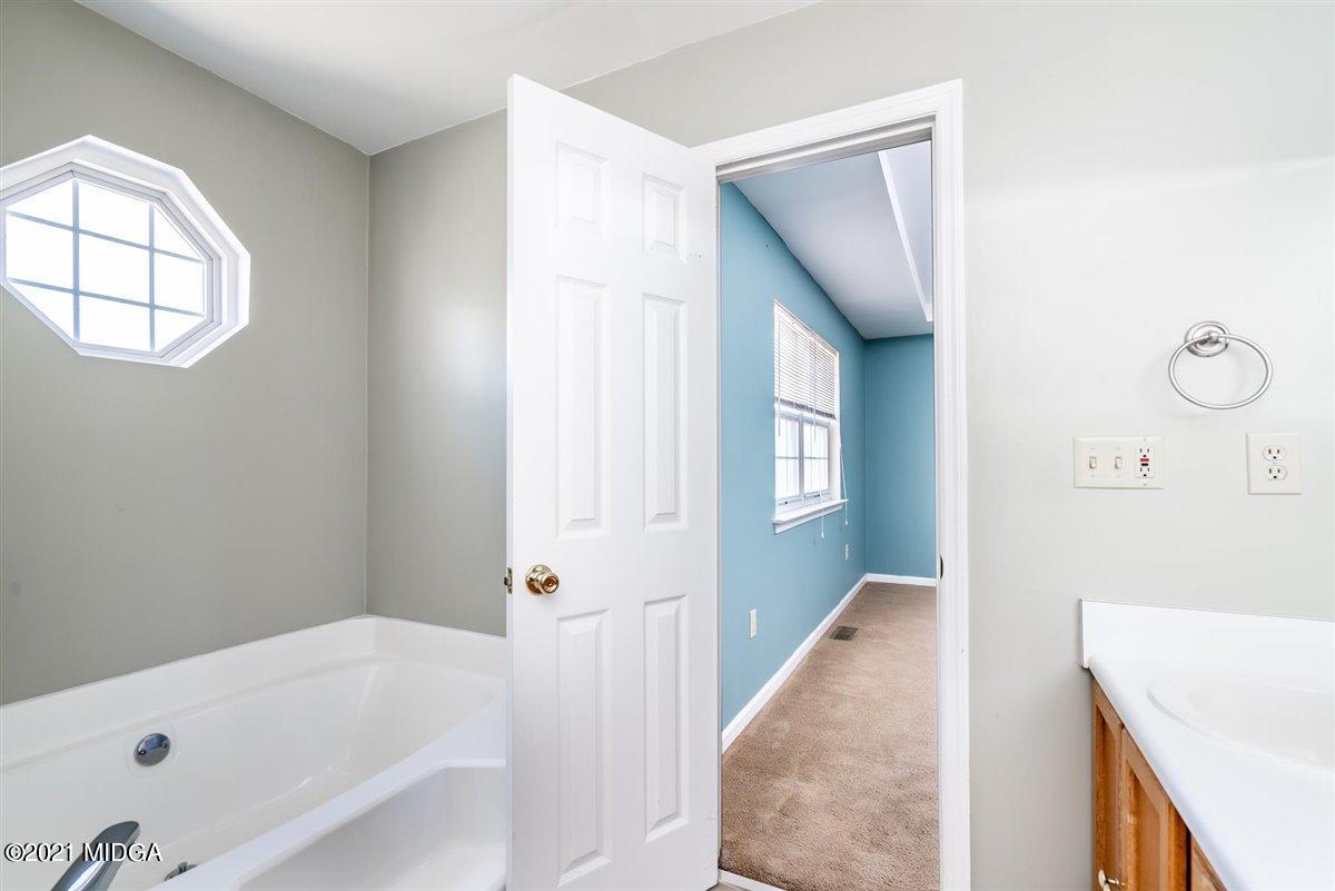 306 Jason Court Macon, GA 31216 - Photo 11 of 22 a bathroom with a bathtub and a shower