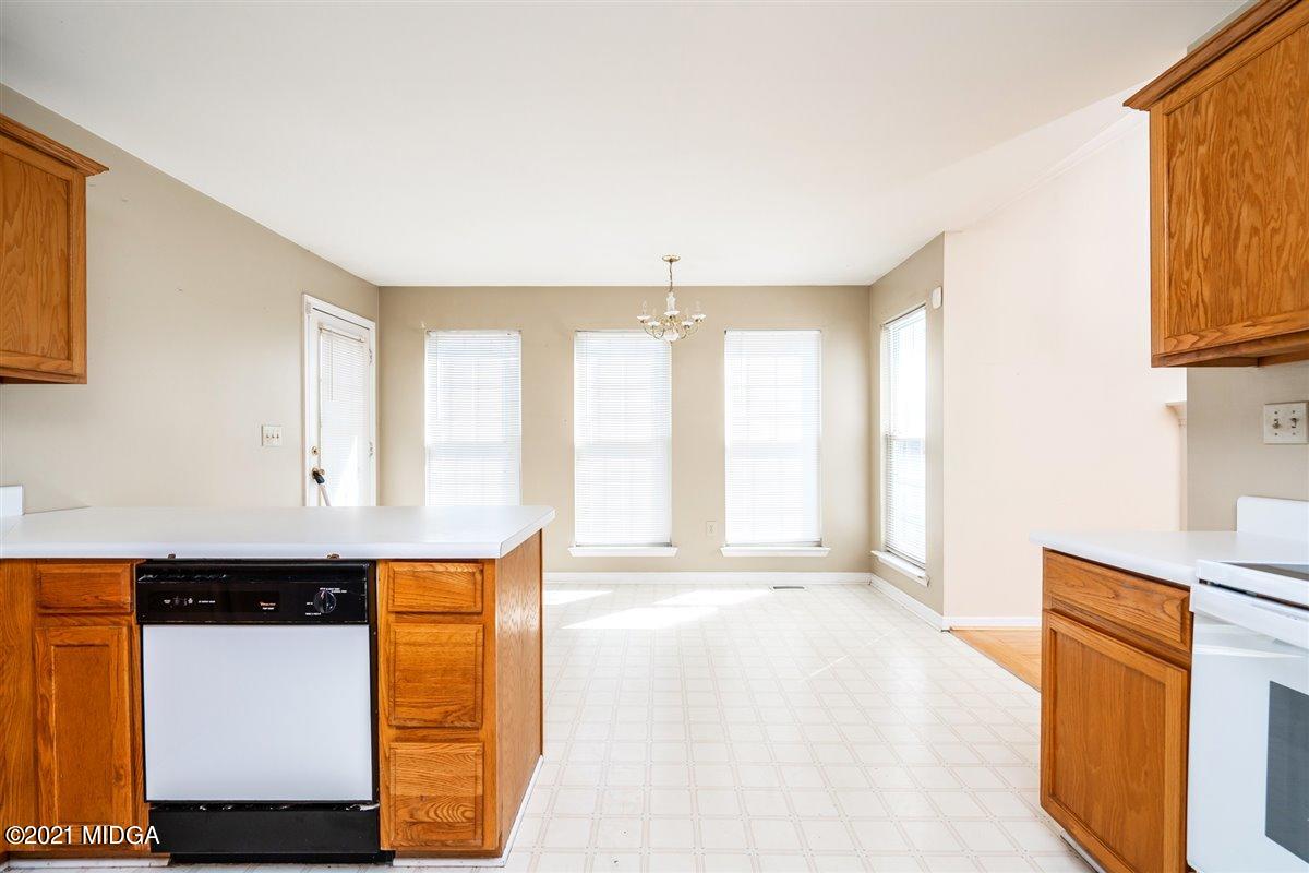 306 Jason Court Macon, GA 31216 - Photo 17 of 22 a view of a kitchen with wooden floor and a window