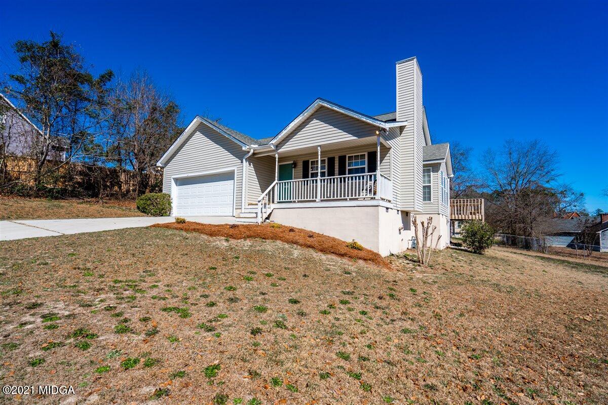 306 Jason Court Macon, GA 31216 - Photo 3 of 22 a front view of a house with a yard