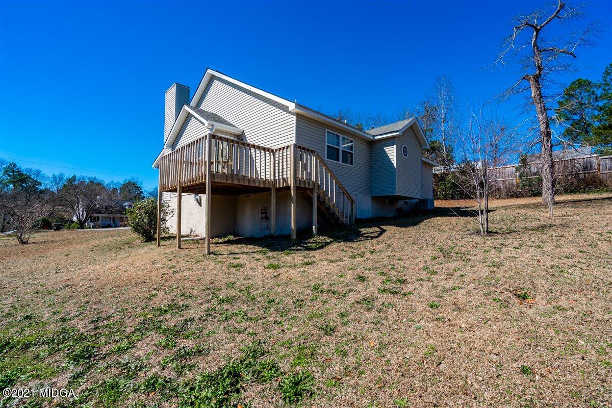 306 Jason Court Macon, GA 31216 - Photo 5 of 22 a view of a house with a yard