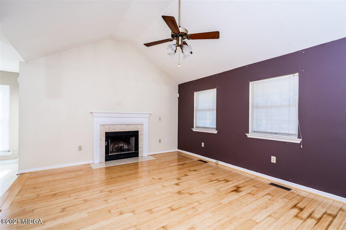 306 Jason Court Macon, GA 31216 - Photo 7 of 22 a view of empty room with a fireplace