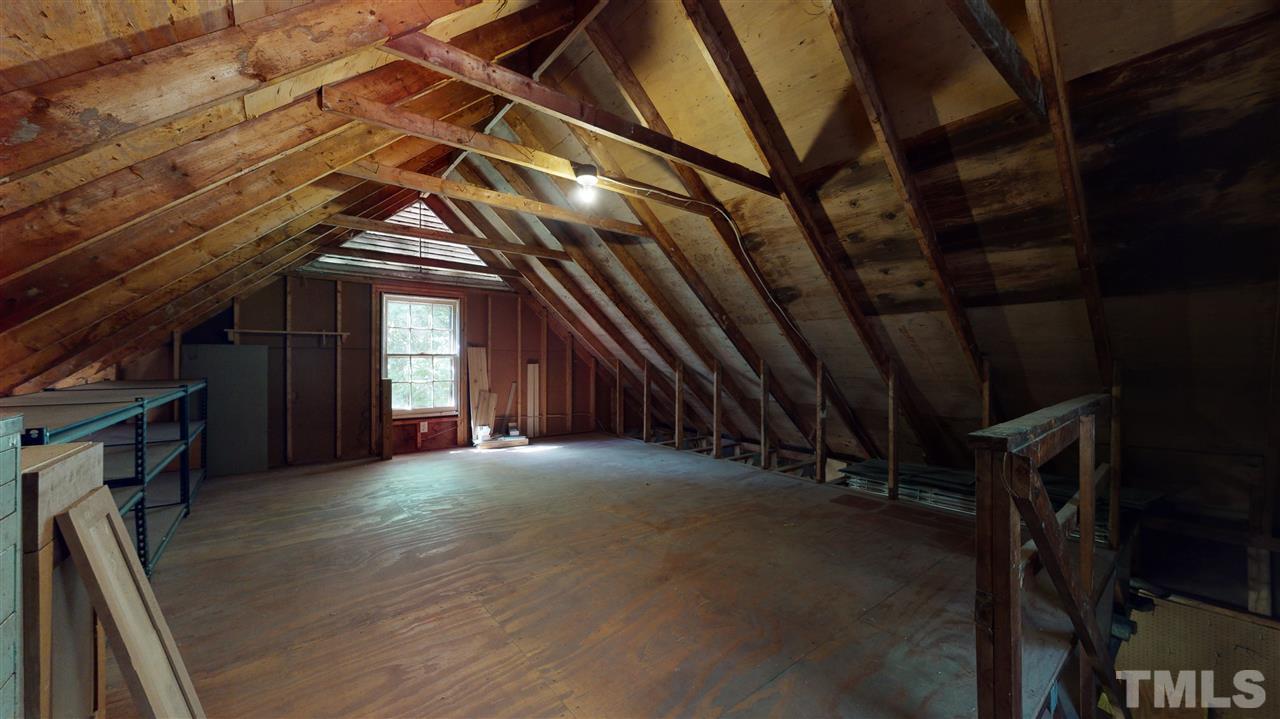 8613 Wood Lawn Drive Raleigh, NC 27613 - Photo 29 of 30 loft area above oversized 2 car garage. floor is reinforced and was used as a woodworking shop.