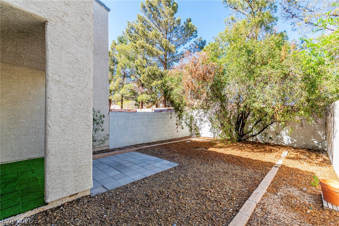 6250 West Flamingo Road, Unit 98 Las Vegas, NV 89103 - Photo 35 of 40 View of yard featuring a fenced backyard and a patio area