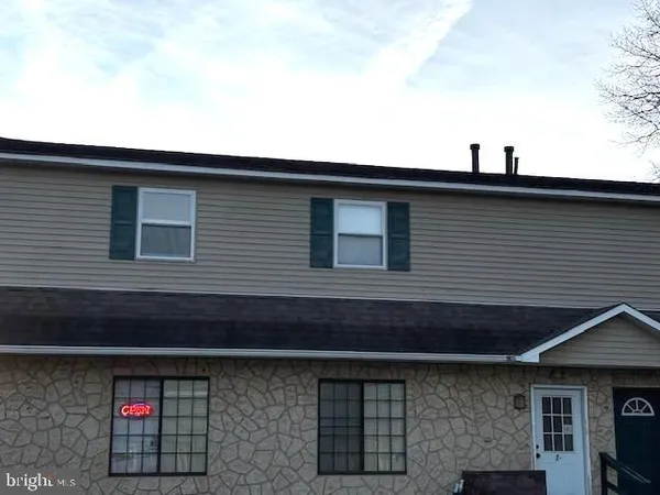 a front view of a house with garage