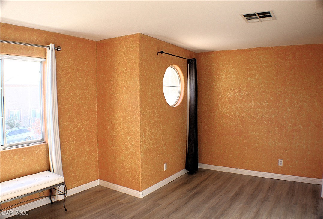 2344 Kenneth Avenue Henderson, NV 89052 - Photo 13 of 25 BEDROOM FEATURING LOVELY WOOD LAMINATE FLOORING!