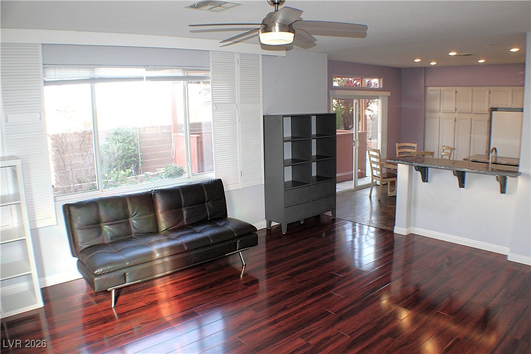 2344 Kenneth Avenue Henderson, NV 89052 - Photo 6 of 25 FAMILY ROOM WITH LIGHT FIXTURE / CEILING FAN & BEAUTIFUL WOOD LAMINATE FLOORING!