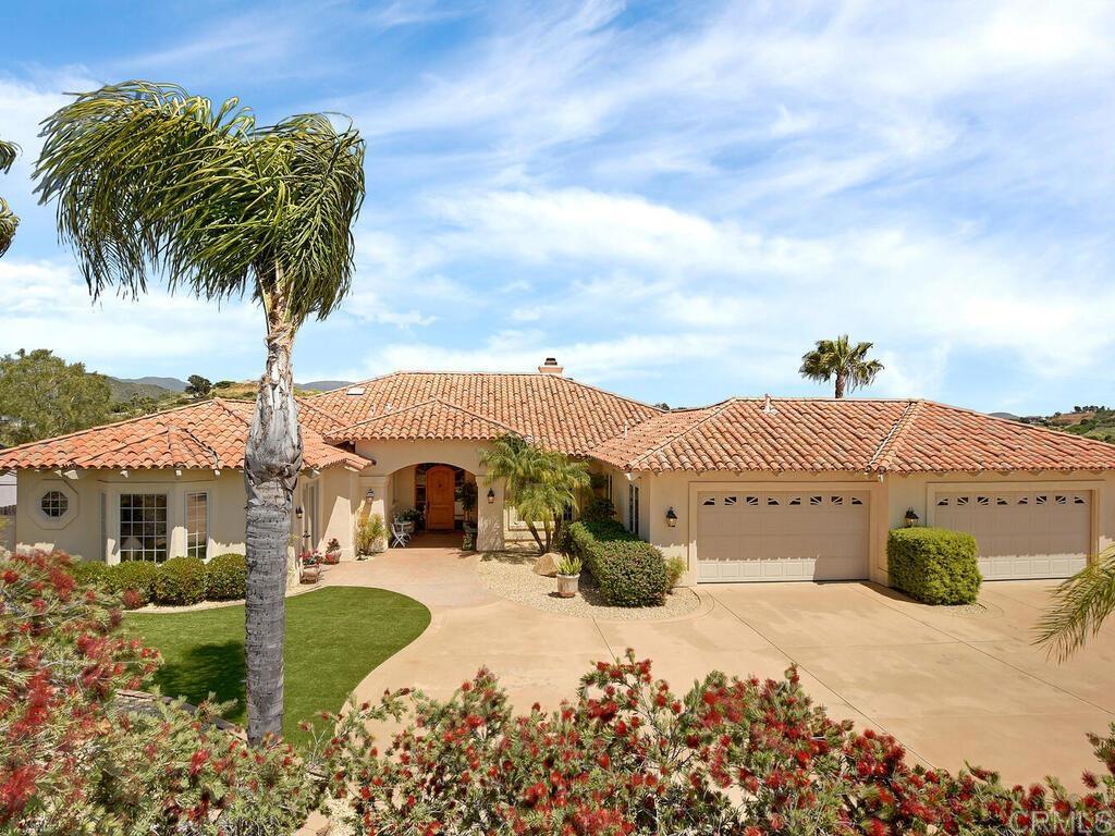 1789 Juniper Ridge Lane Fallbrook, CA 92028 - Photo 1 of 1 a front view of a house with a yard
