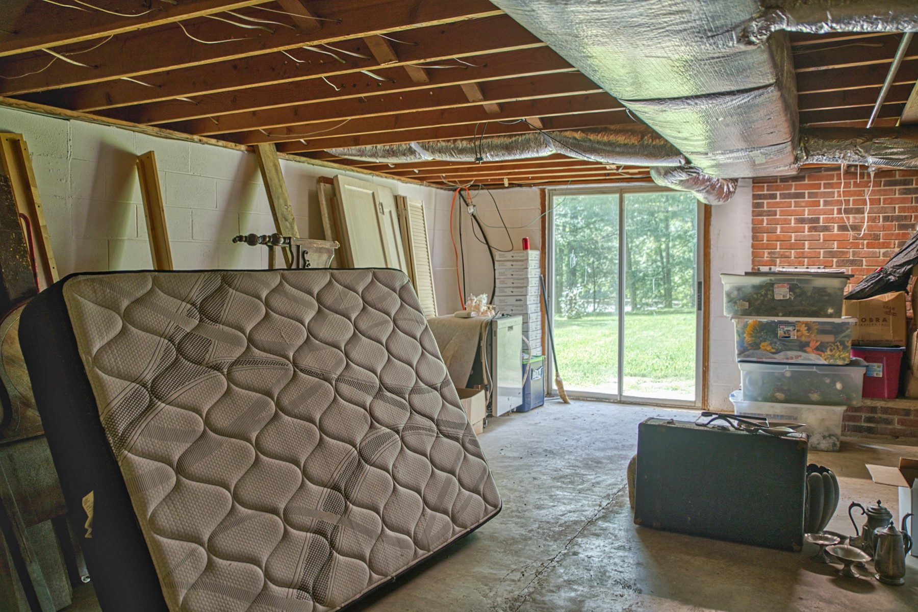 260 Fate Ivy Road Monterey, TN 38574 - Photo 16 of 32 a bed sitting in a room next to a window