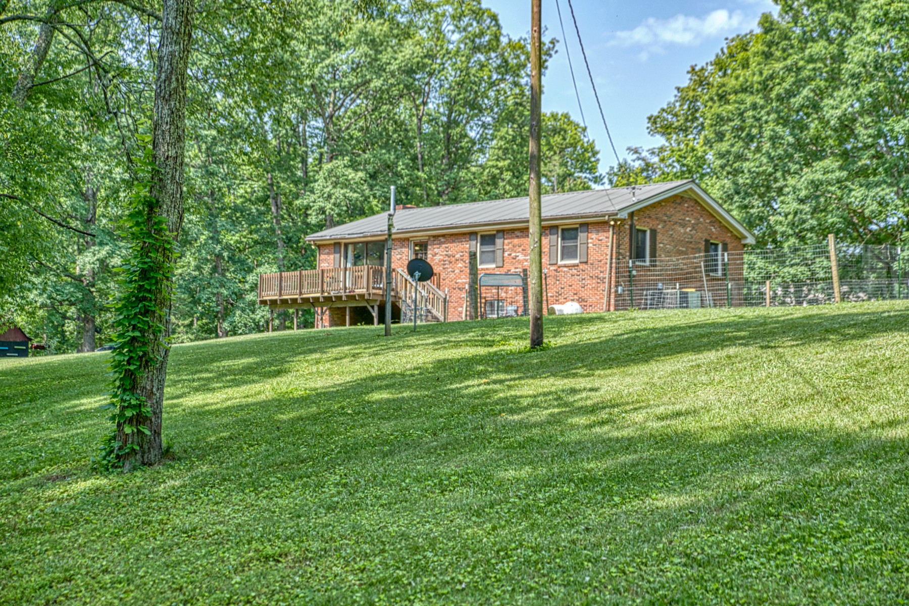 260 Fate Ivy Road Monterey, TN 38574 - Photo 23 of 32 a front view of a house with yard and green space