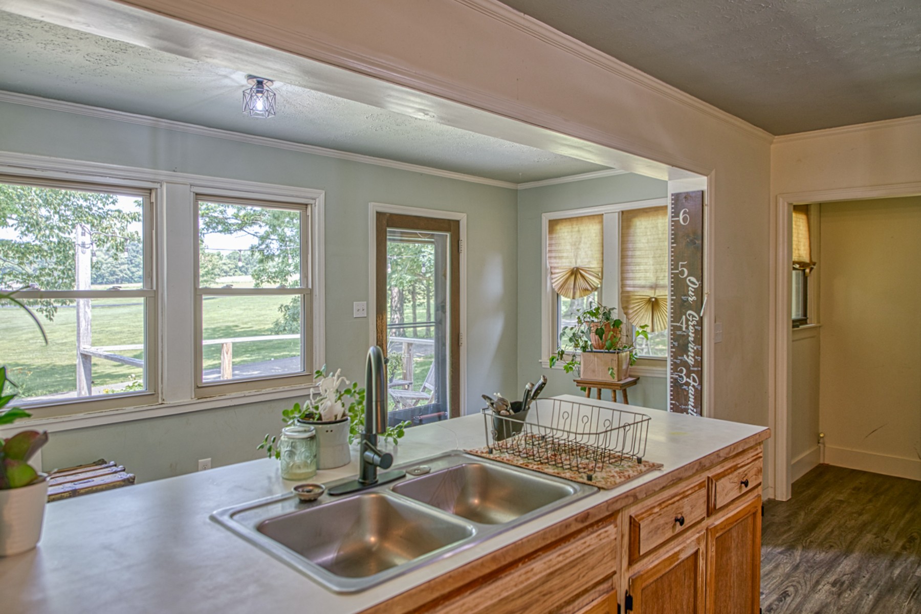 260 Fate Ivy Road Monterey, TN 38574 - Photo 5 of 32 a kitchen with a sink and wooden cabinets