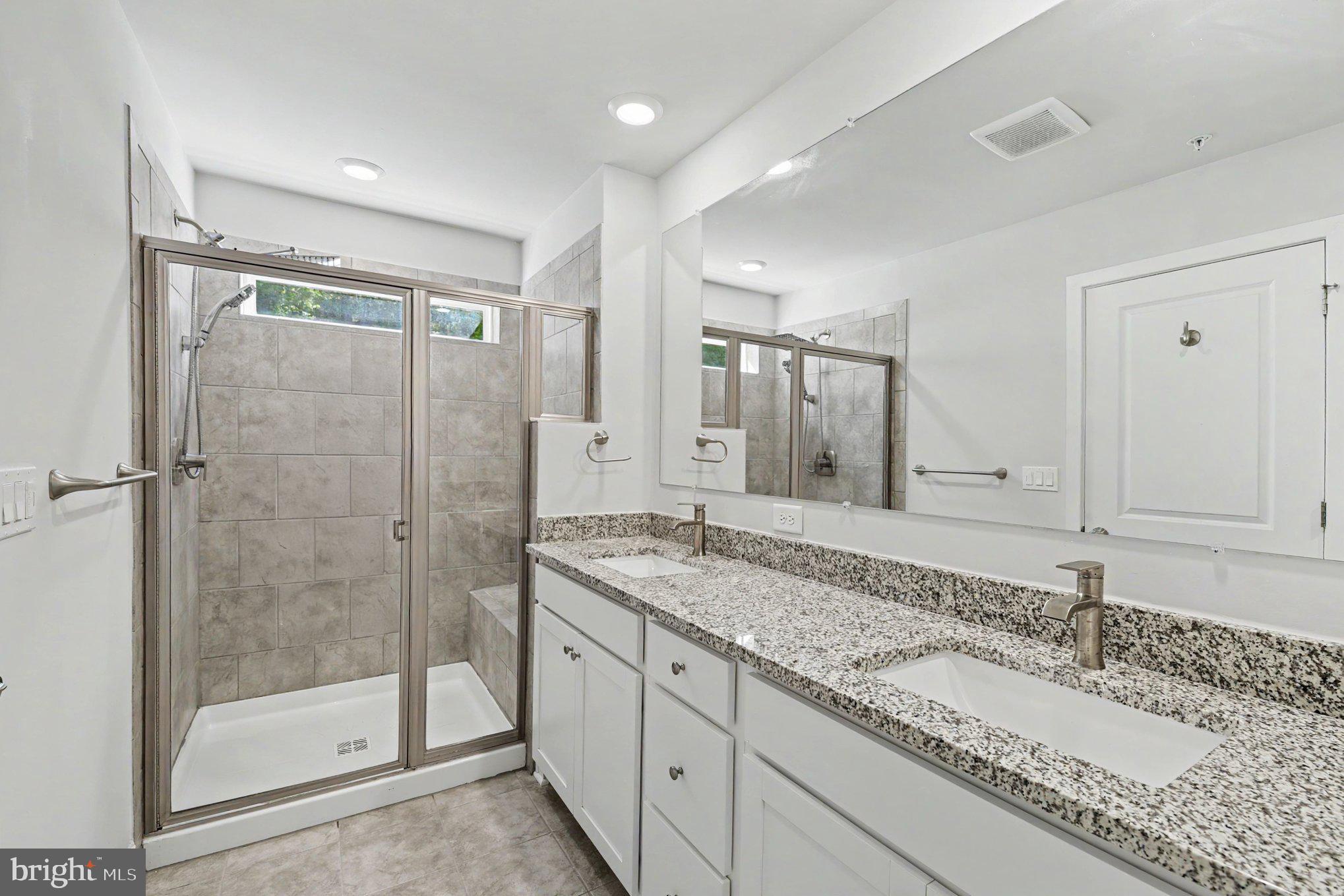 238 Waterstone Road Essex, MD 21221 - Photo 26 of 39 a bathroom with a granite countertop sink mirror and shower